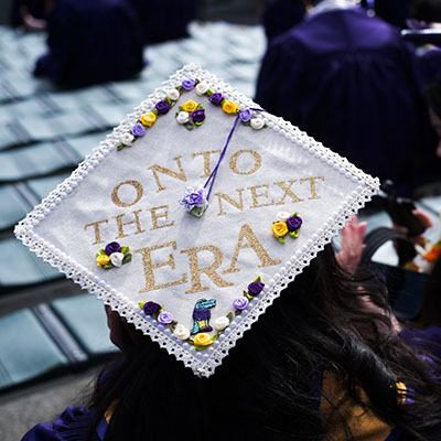 a decorated mortar board that says "On to the next Era."